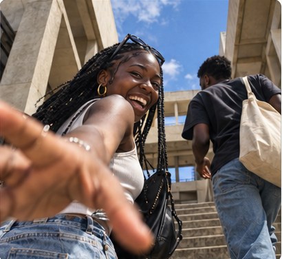 Student in a first-day outfit waving on the stairs